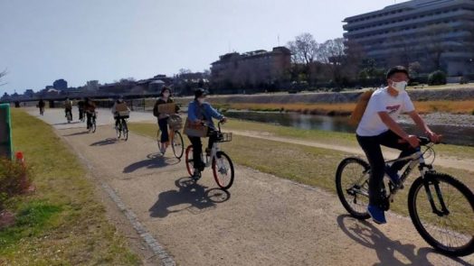 Fridays For Future Kyoto members riding along Kamo River.