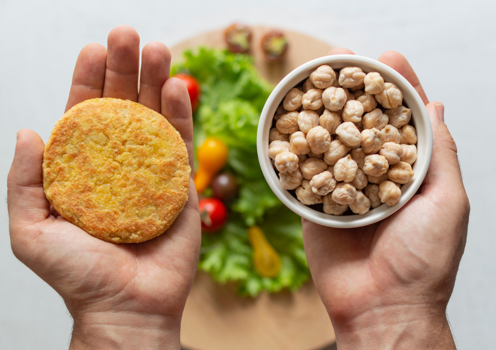 Picture of chickpeas compared to a chickpea-based patty.