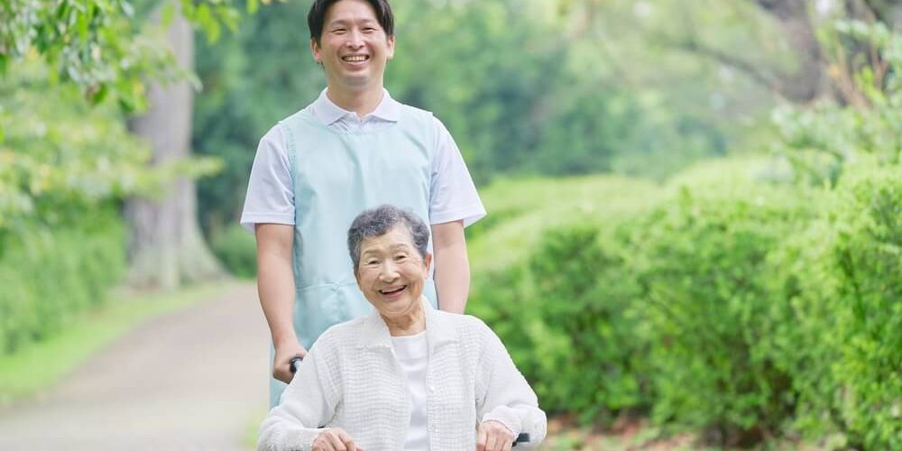 an older person and a carer